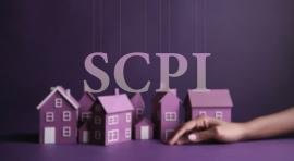 Le mot SCPI posé au-dessus de maquettes de maisons