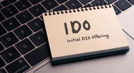 Bloc note sur un ordinateur illustrant l'Initial DEX Offering (IDO)